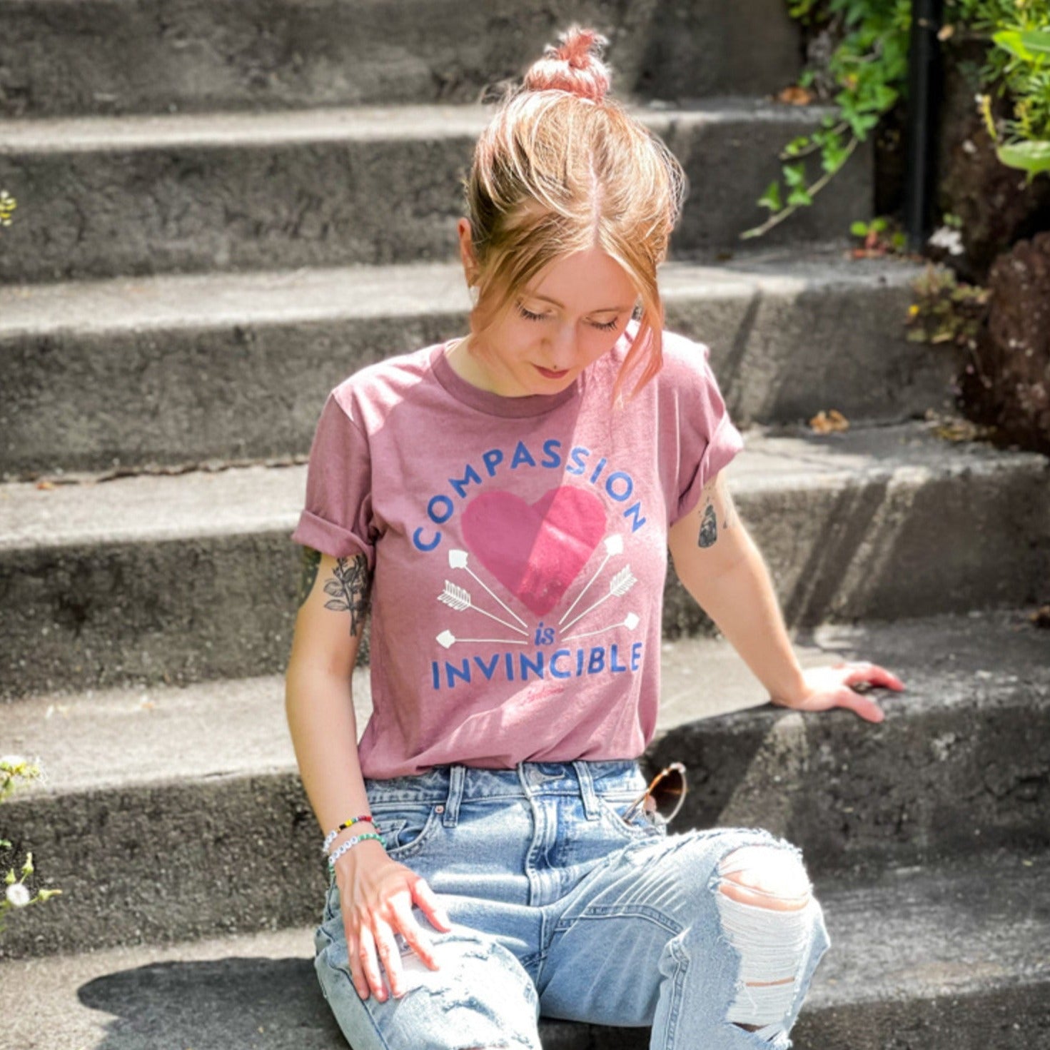 Compassion Is Invincible Heather Mauve Unisex Tee The Grinning Goat